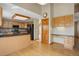 Spacious kitchen with oak cabinets, granite counters, stainless appliances, wood floors, and an eat-in bar area at 18292 E Caspian Pl, Aurora, CO 80013