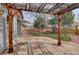 Charming backyard patio with pergola and lush landscaping at 18292 E Caspian Pl, Aurora, CO 80013