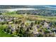 Aerial view showcasing a neighborhood near a lake, open space and bike paths at 7706 S Crocker Ct, Littleton, CO 80120