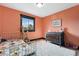 Cozy bedroom with a bright window, decorative dresser, and playful stuffed animals at 7706 S Crocker Ct, Littleton, CO 80120