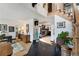 Spacious entryway with wood floors, staircase, and decorative accents leading into the living spaces at 7706 S Crocker Ct, Littleton, CO 80120