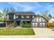Beautiful two-story home featuring brick and Tudor accents, an attached two-car garage, and a well-maintained lawn at 7706 S Crocker Ct, Littleton, CO 80120