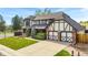 Well-kept two-story home with brick and Tudor accents, an attached two-car garage, and a wide driveway at 7706 S Crocker Ct, Littleton, CO 80120
