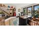 Elegant office with natural light, hardwood floors, decorative accents, and a comfortable seating area at 7706 S Crocker Ct, Littleton, CO 80120