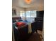 Inviting bedroom featuring a large window and wooden floors at 1233 Lansing St, Aurora, CO 80010
