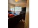 Comfortable bedroom featuring hardwood floors, a window, and a closet at 1233 Lansing St, Aurora, CO 80010