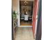 Inviting entryway featuring neutral tile flooring and a peek into the dining area with a modern table setting at 1233 Lansing St, Aurora, CO 80010