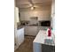 Kitchen with white cabinets, a stainless steel sink, and plenty of counter space at 1233 Lansing St, Aurora, CO 80010