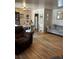 Comfortable living room and dining area with hardwood floors and neutral tones at 1233 Lansing St, Aurora, CO 80010