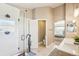 Bright bathroom with tiled shower, and view of the main bedroom at 17158 Cornerstone Dr, Parker, CO 80134