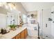 Well-lit bathroom featuring double sinks, walk-in shower, and soaking tub at 17158 Cornerstone Dr, Parker, CO 80134