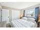 Bright bedroom with a window, closet and neutral decor at 17158 Cornerstone Dr, Parker, CO 80134