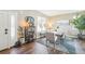 Dining room with wood floors, built-in display cabinet, and seating for six at 17158 Cornerstone Dr, Parker, CO 80134