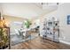 Dining room with neutral tones, desk, hardwood floors, bookshelf, and seating for eight at 17158 Cornerstone Dr, Parker, CO 80134