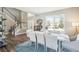 Dining room with neutral walls, wood floors, staircase, and seating for six at 17158 Cornerstone Dr, Parker, CO 80134