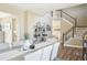 Elegant dining area with stairs to the second floor and views into other living spaces at 17158 Cornerstone Dr, Parker, CO 80134