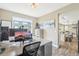 Functional home office space with modern desk setup and an open view to the kitchen at 17158 Cornerstone Dr, Parker, CO 80134