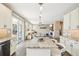 Kitchen with an island, granite countertops, and a view to the living room with a fireplace at 17158 Cornerstone Dr, Parker, CO 80134