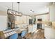 Well-lit kitchen with granite counters, modern appliances, and connected dining area at 17158 Cornerstone Dr, Parker, CO 80134