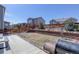 Spacious backyard featuring a wooden fence and a concrete patio, perfect for entertaining or relaxing outdoors at 17718 Leisure Lake Dr, Monument, CO 80132