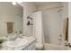 Bathroom with a sink, granite counters, and a bathtub with a shower at 17718 Leisure Lake Dr, Monument, CO 80132