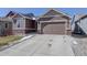 Charming home with a two-car garage and well-maintained lawn offers curb appeal and convenience at 17718 Leisure Lake Dr, Monument, CO 80132