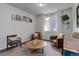 Inviting living room with comfortable seating, a round coffee table, and decorative elements at 17718 Leisure Lake Dr, Monument, CO 80132