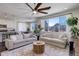 Spacious living room with a large window, an open floor plan, and views of the neighborhood at 17718 Leisure Lake Dr, Monument, CO 80132