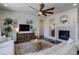 Comfortable living room with a fireplace, modern decor, and an inviting atmosphere at 17718 Leisure Lake Dr, Monument, CO 80132