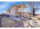 Expansive backyard features a well-maintained lawn, patio, and an outdoor grilling area at 5011 Troy St, Denver, CO 80239