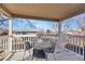 Outdoor balcony with table and chairs, perfect for enjoying a peaceful view at 5011 Troy St, Denver, CO 80239