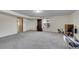 Spacious carpeted basement with ample natural light, ready for customization and versatile use at 5011 Troy St, Denver, CO 80239