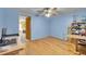 Bright bedroom featuring a wood floor and a ceiling fan, offering comfort and functionality at 5011 Troy St, Denver, CO 80239