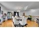 A dining room with hardwood floors, white walls, and a decorative chandelier at 5011 Troy St, Denver, CO 80239