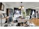 Bright dining room with decorative chandelier and unique decor, perfect for entertaining at 5011 Troy St, Denver, CO 80239