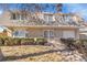 Charming two-story brick home with well-maintained landscaping and attached garage at 5011 Troy St, Denver, CO 80239