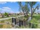 Scenic community view showcasing a stream, walking path, and playground, perfect for Gathering-friendly living at 9757 Ash Ln, Thornton, CO 80229
