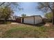 Spacious backyard featuring a blend of grass, brick and white siding, offering a private retreat at 6013 W 62Nd Ave, Arvada, CO 80033