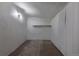 Basement with white walls, painted wood floor, shelf, and good lighting at 6013 W 62Nd Ave, Arvada, CO 80033