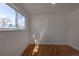 Bright bedroom featuring hardwood floors, a window, and neutral paint at 6013 W 62Nd Ave, Arvada, CO 80033