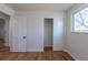 Cozy bedroom with closet, wood floors, and a bright window at 6013 W 62Nd Ave, Arvada, CO 80033