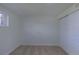 Empty bedroom features carpet, a window, and a closet with sliding doors at 6013 W 62Nd Ave, Arvada, CO 80033