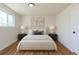 Bedroom with hardwood floors, natural light, and a modern decor at 6013 W 62Nd Ave, Arvada, CO 80033