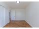 Bedroom with hardwood floors, two closets, and an entrance to hallway at 6013 W 62Nd Ave, Arvada, CO 80033