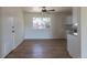 Bright dining area with hardwood floors, white walls, and a view of the backyard at 6013 W 62Nd Ave, Arvada, CO 80033