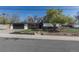Charming home features brick accents, mature trees, an attached garage, and well-maintained landscaping at 6013 W 62Nd Ave, Arvada, CO 80033