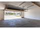 Spacious garage with an open door and view of the neighborhood at 6013 W 62Nd Ave, Arvada, CO 80033