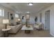 Bright living room featuring recessed lighting, neutral walls, and stylish contemporary decor at 6013 W 62Nd Ave, Arvada, CO 80033