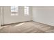 Comfortable bedroom featuring plush carpet, neutral walls, and two windows allowing for natural light at 8895 San Antonio St, Littleton, CO 80125
