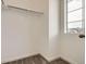 Walk-in closet with carpet flooring, shelving, and a window that provides natural light at 8895 San Antonio St, Littleton, CO 80125
